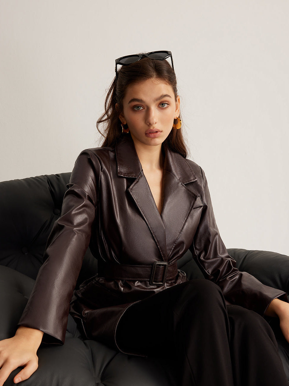 Celeste Zoe belted faux leather jacket for women by Christine Brewer, featuring a stylish design and adjustable waist belt.