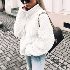Chunky knit turtleneck sweater for women by Christine Brewer, featuring an oversized fit and cozy design.