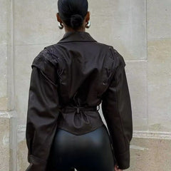 Tailored faux leather blazer for women by Christine Brewer, featuring a sleek, fitted design and classic collar.