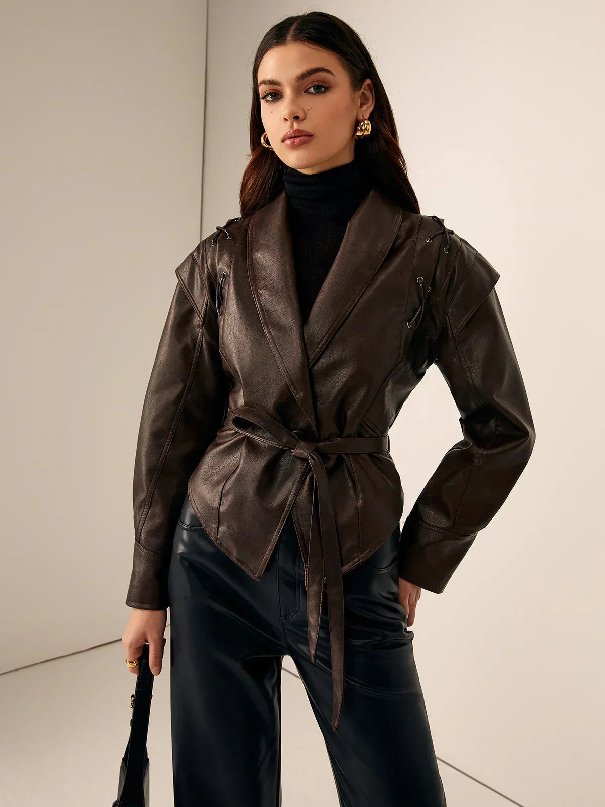 Faux leather blazer for women from Christine Brewer's Aria collection, tailored jacket with sleek design and classic fit.