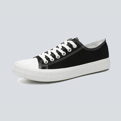 Comfortable women's low top canvas sneakers by Christine Brewer, featuring a casual design and breathable fabric.