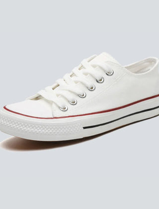 Comfortable women's low-top canvas sneakers by Christine Brewer, featuring a casual design and comfortable fit.