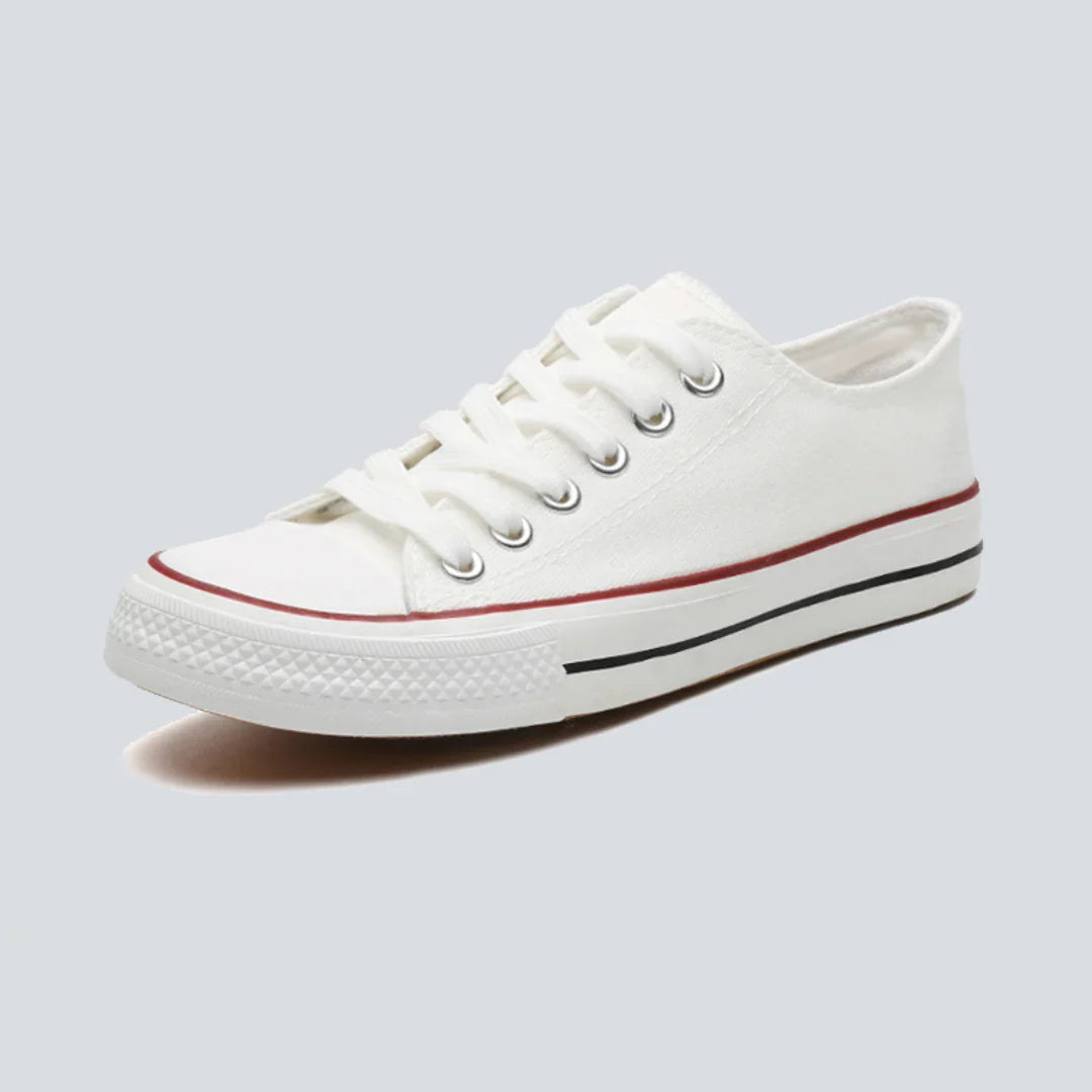 Comfortable women's low-top canvas sneakers by Christine Brewer, featuring a casual design and comfortable fit.