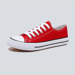 Comfortable women's low-top canvas sneakers by Christine Brewer, featuring a casual design and cushioned soles.