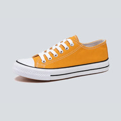 Comfortable women's low top canvas sneakers by Christine Brewer, featuring a casual design and cushioned insoles for everyday wear.