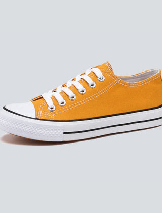 Comfortable women's low top canvas sneakers by Christine Brewer, featuring a casual design and cushioned insoles for everyday wear.