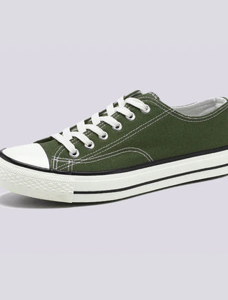 Comfortable women's low-top canvas sneakers by Christine Brewer, featuring a casual design and white laces.
