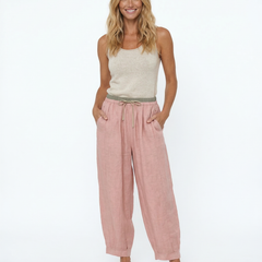 Light beige tapered linen trousers for women, loose pull-on style by Christine Brewer, featuring a relaxed fit and comfortable design.