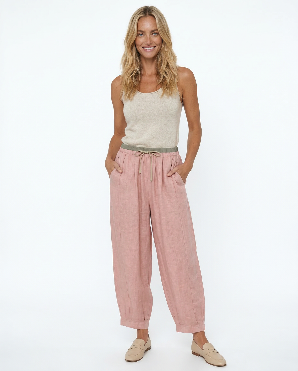 Light beige tapered linen trousers for women, loose pull-on style by Christine Brewer, featuring a relaxed fit and comfortable design.