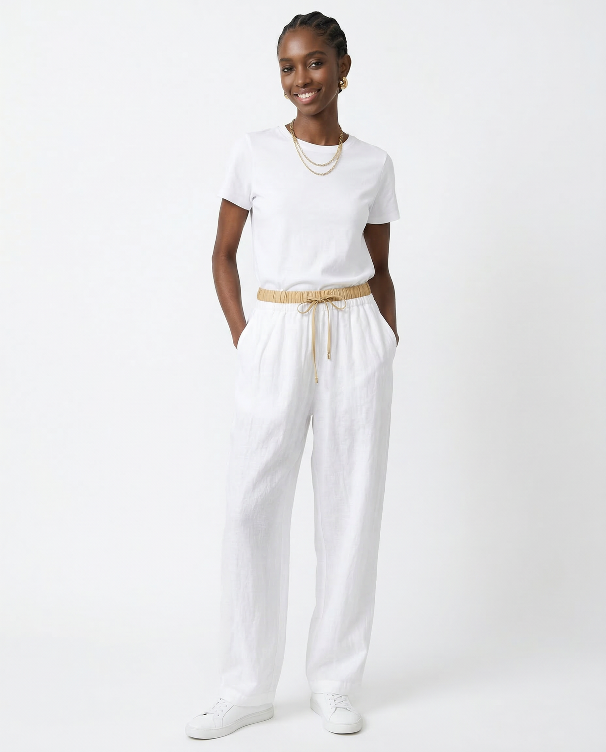 Women’s tapered linen trousers by Christine Brewer featuring loose fit, pull-on design, and lightweight breathable fabric.