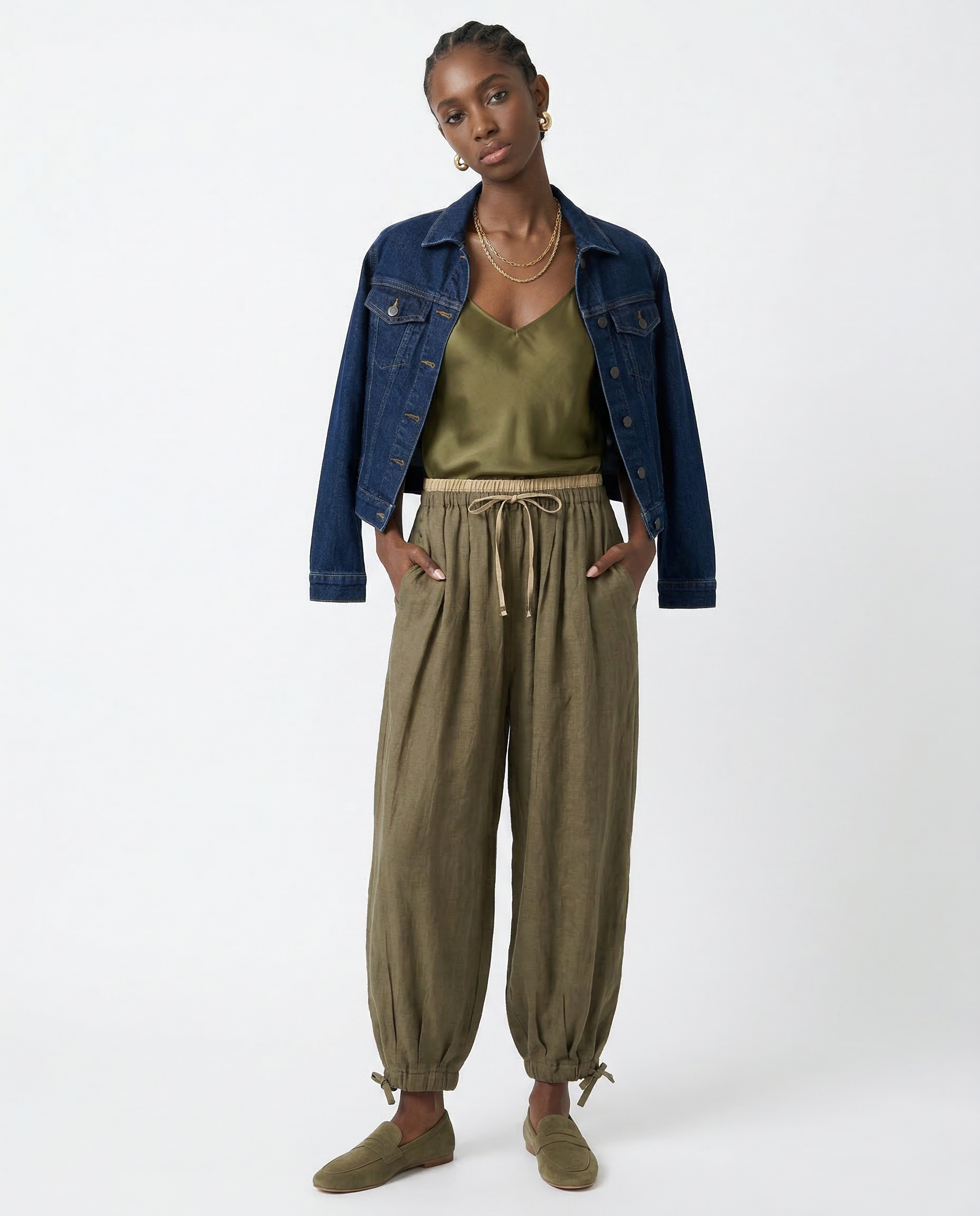 Women’s tapered linen trousers by Christine Brewer, loose pull-on pants with a relaxed fit and natural linen fabric.