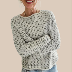 Cream-colored Ella relaxed fit sweater by Christine Brewer, featuring a cozy knit texture and casual, comfortable style.