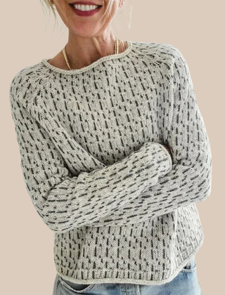 Cream-colored Ella relaxed fit sweater by Christine Brewer, featuring a cozy knit texture and casual, comfortable style.