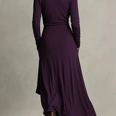 Solid color high-neck long-sleeved irregular casual maxi dress by Christine Brewer, shown hanging with flowing fabric details.