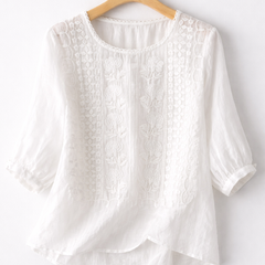 White floral blouse for women from Christine Brewer's Isla collection, featuring lightweight fabric and feminine design details.
