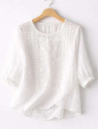 White floral blouse for women from Christine Brewer's Isla collection, featuring lightweight fabric and feminine design details.