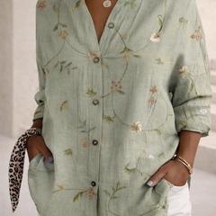 Lily floral graphic blouse for women by Christine Brewer, featuring vibrant floral print and lightweight fabric.