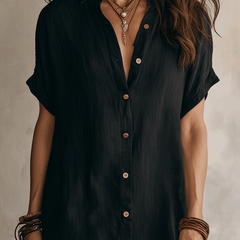 Black linen relaxed midi dress for women by Christine Brewer, featuring a flowy silhouette and casual elegant style.