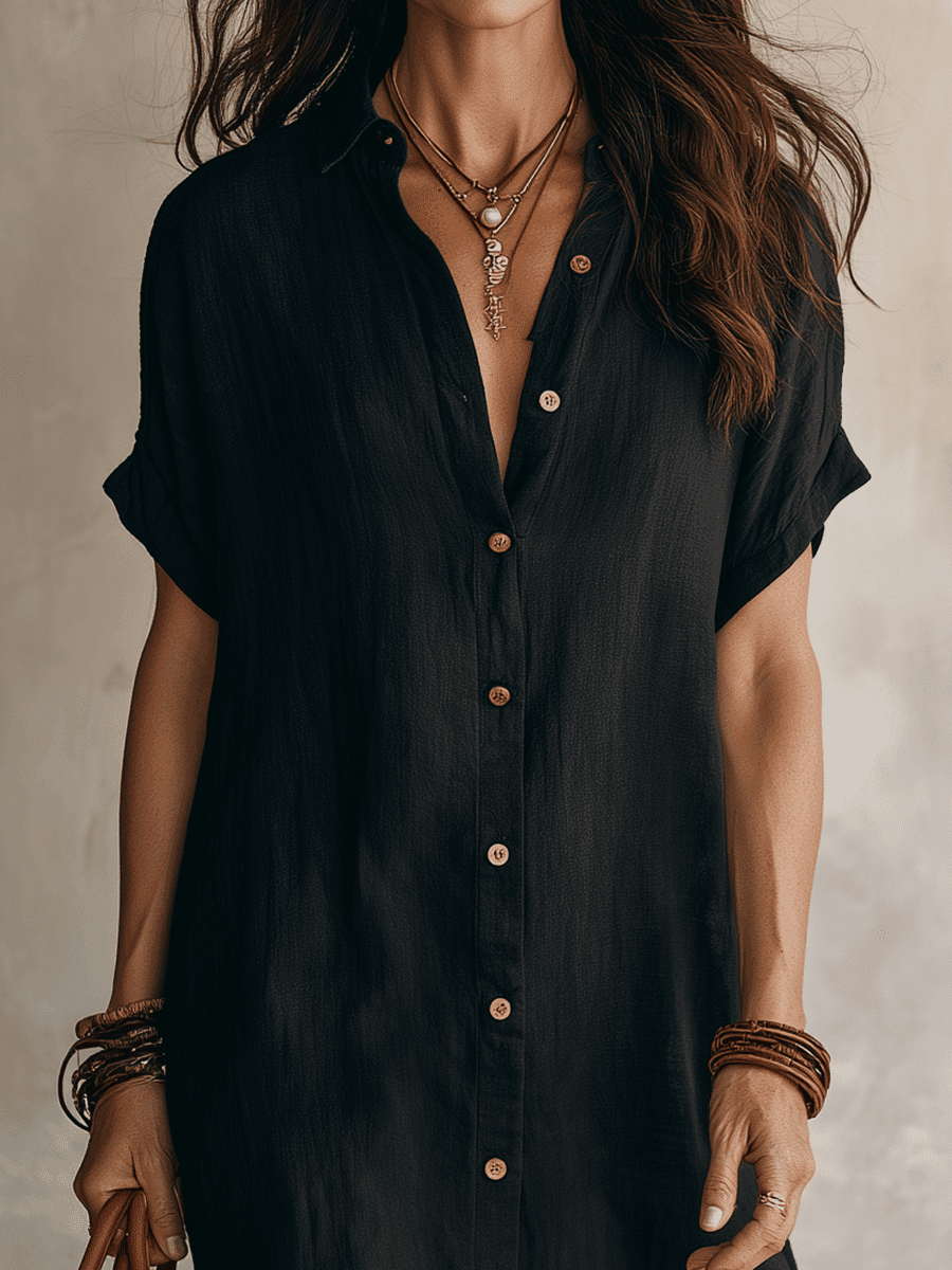 Black linen relaxed midi dress for women by Christine Brewer, featuring a flowy silhouette and casual elegant style.