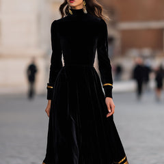 Elegant velvet midi dress by Christine Brewer featuring gold trim, showcasing a stylish and sophisticated evening wear look.