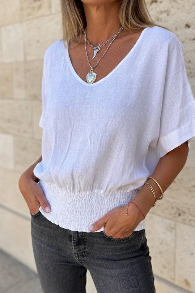 Christine Brewer Ella V-Neck Top for Women, stylish cotton T-shirt in a versatile V-neck design, shown in natural fabric detail.