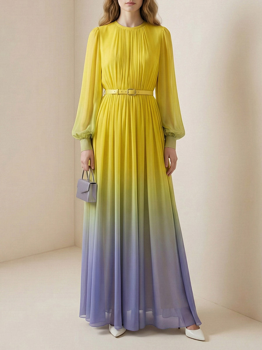 Christine Brewer high waisted maxi dress with long sleeves, belt, contrast color gradient, pleats, split joint, and round neck design.