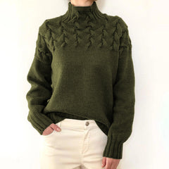 Dark green Tessa women's turtleneck sweater by Christine Brewer, cozy knitwear with a high neckline and ribbed cuffs.