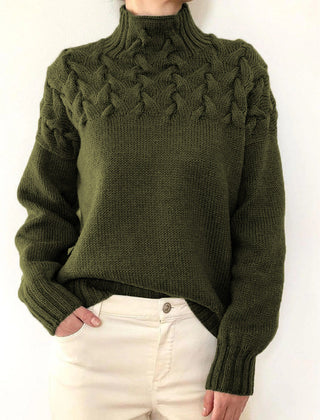 Dark green Tessa women's turtleneck sweater by Christine Brewer, cozy knitwear with a high neckline and ribbed cuffs.