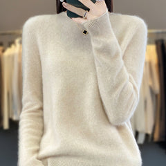 Delilah cozy fluffy sweater by Christine Brewer, relaxed fit with elegant, soft, and textured knit fabric, displayed on a hanger.