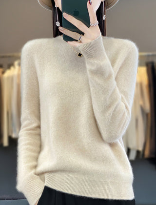Delilah cozy fluffy sweater by Christine Brewer, relaxed fit with elegant, soft, and textured knit fabric, displayed on a hanger.