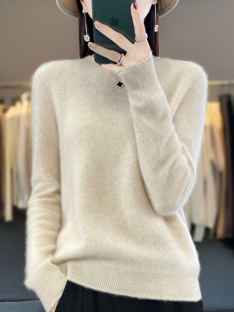 Delilah cozy fluffy sweater by Christine Brewer, relaxed fit with elegant, soft, and textured knit fabric, displayed on a hanger.