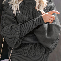 Christine Brewer Mila cable knit high neck sweater for women, featuring a cozy design and ribbed texture in a neutral color.