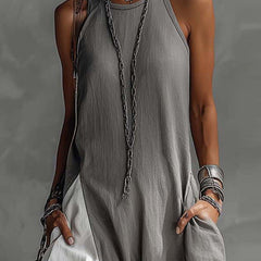 Color-blocked round neck sleeveless maxi dress by Christine Brewer featuring casual style, pockets, and a loose fit.