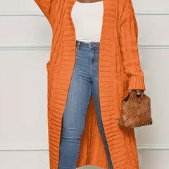 Sadie asymmetric knit cardigan for women by Christine Brewer, featuring a stylish, cozy coat design with a unique uneven hem.