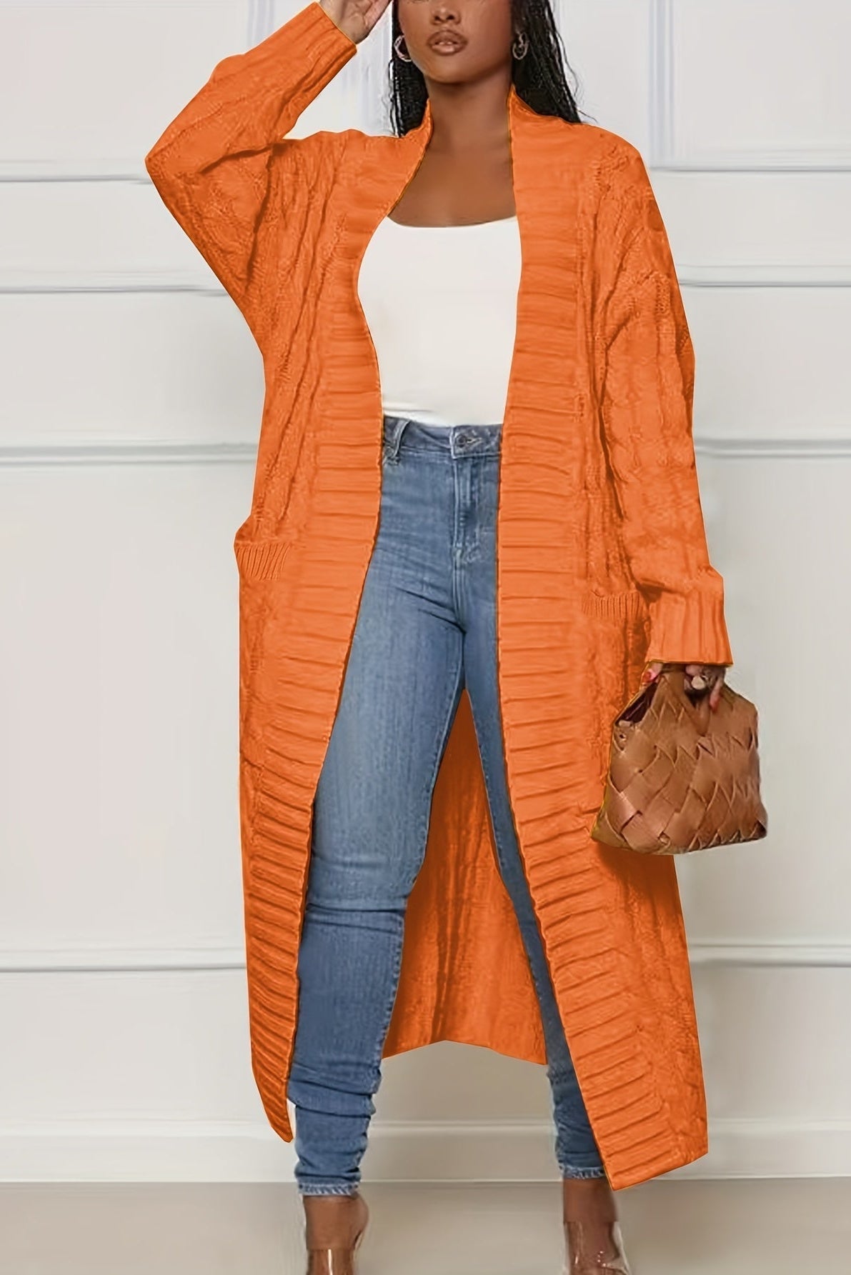 Sadie asymmetric knit cardigan for women by Christine Brewer, featuring a stylish, cozy coat design with a unique uneven hem.