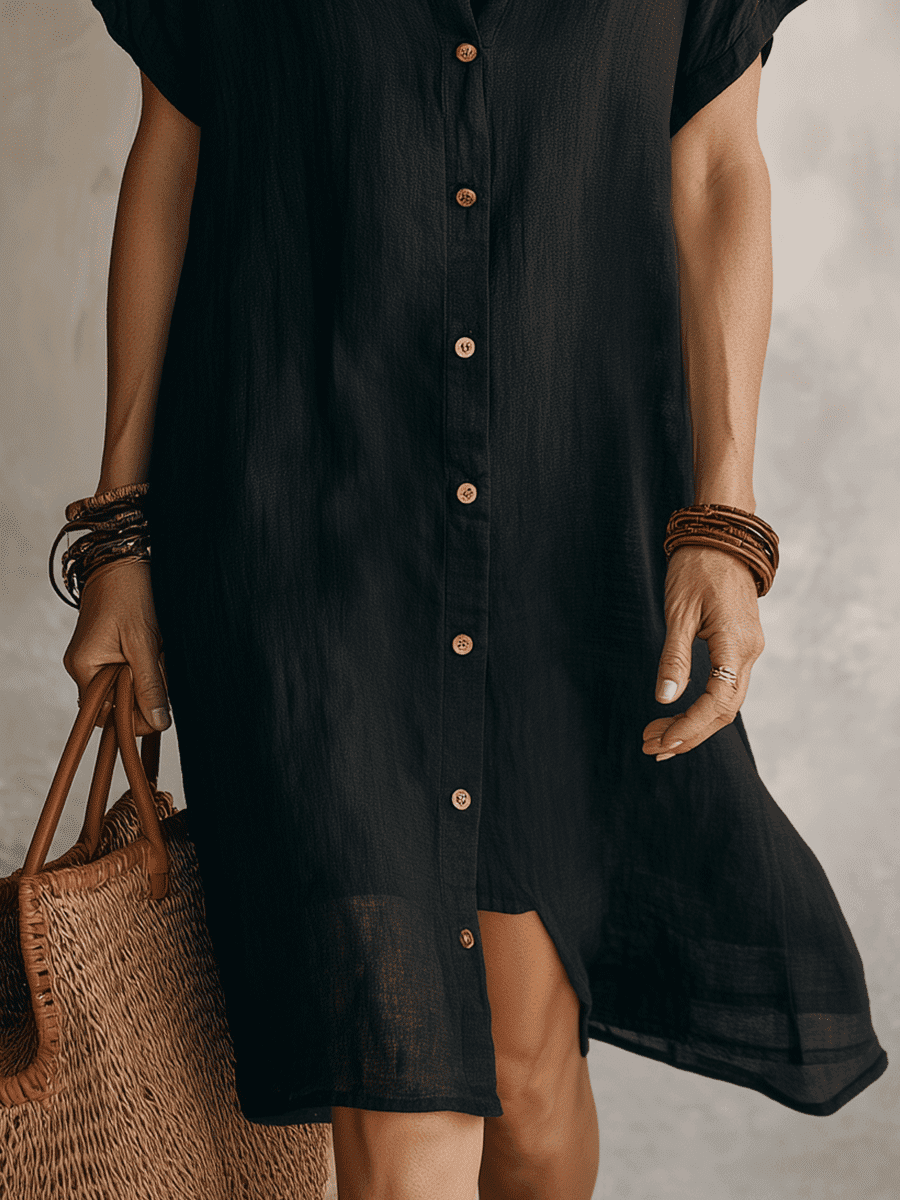Black linen relaxed midi dress for women by Christine Brewer, featuring a flowing silhouette and casual elegant style.