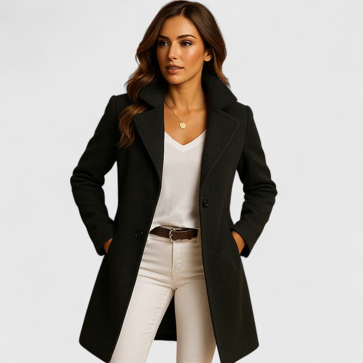 Long, elegant women's coat by Christine Brewer with button details, featuring a tailored fit and classic style.