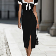 Black and white contrast trim midi dress by Christine Brewer, showcasing a sleek, stylish dress with a fitted silhouette and elegant design.