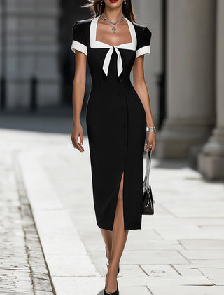 Black and white contrast trim midi dress by Christine Brewer, showcasing a sleek, stylish dress with a fitted silhouette and elegant design.