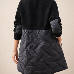 Long quilted puffer jacket for women from Christine Brewer, featuring a stylish design and quilted texture in a vibrant color.