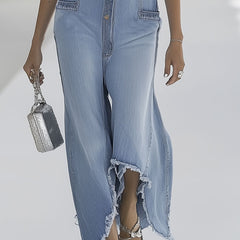 Light blue denim sleeveless wide-leg jumpsuit with raw edges, styled as women's pants by Christine Brewer.