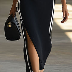 Black knit V-neck maxi dress for women by Christine Brewer, featuring a flowing silhouette and comfortable fabric.