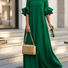 White Christine Brewer maxi dress with half sleeves, loose fit, solid color, off-the-shoulder design, perfect for casual wear.