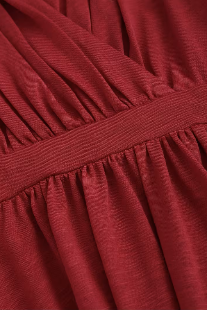 Olivia V-neck top for women by Christine Brewer, featuring a stylish neckline and comfortable fit, shown in a casual top image.