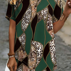 A woman wearing a Christine Brewer Ava graphic crew neck T-shirt, featuring a colorful print on a casual cotton top.
