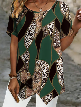 A woman wearing a Christine Brewer Ava graphic crew neck T-shirt, featuring a colorful print on a casual cotton top.