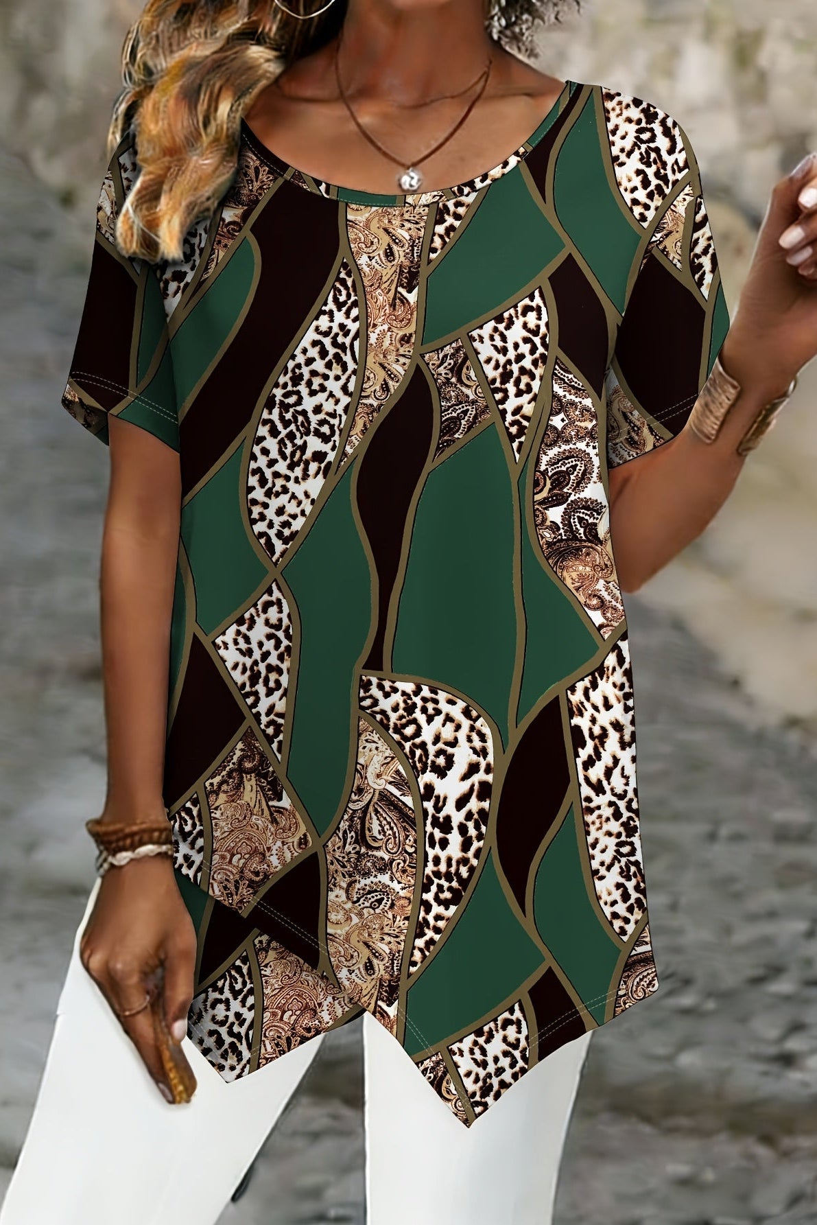 A woman wearing a Christine Brewer Ava graphic crew neck T-shirt, featuring a colorful print on a casual cotton top.