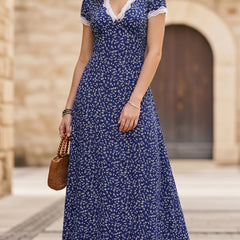 White lace patch floral V-neck maxi dress by Christine Brewer, featuring intricate lace details and a flowing silhouette.