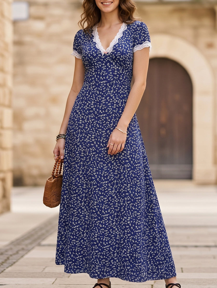 White lace patch floral V-neck maxi dress by Christine Brewer, featuring intricate lace details and a flowing silhouette.