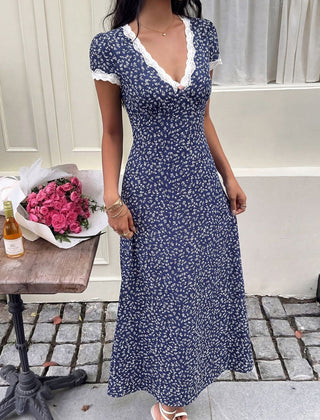 White floral lace patch V-neck maxi dress by Christine Brewer featuring delicate lace details and flowing fabric.